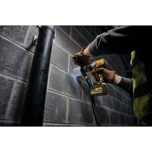 20 Volt to 60 Volt 6 AMP hours Battery powered drill being used to drill a hole