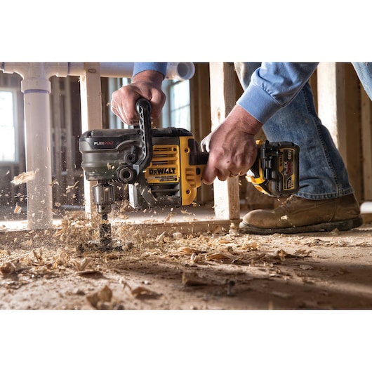 FLEXVOLT Stud and joist drill with E clutch System 1 drilling  floor.