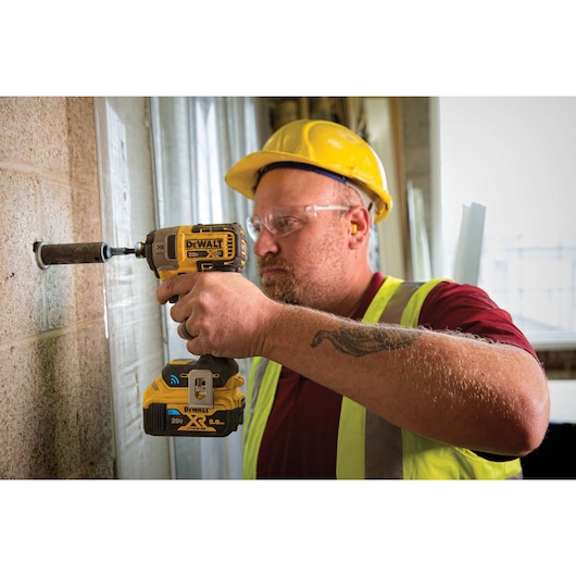 BRUSHLESS TOOL CONNECT being used by a workman