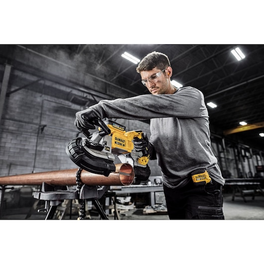 DEWALT Bandsaw is used to cut copper pipe in a pre fabrication shop.