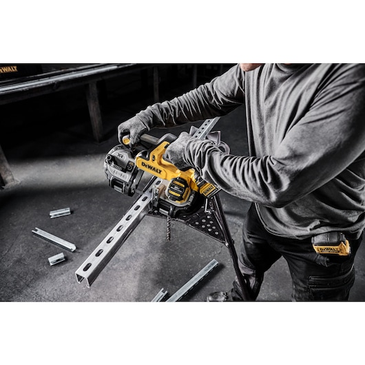 DEWALT Single Trigger Bandsaw is used to cut strut from a pipe stand in a mechanical room.