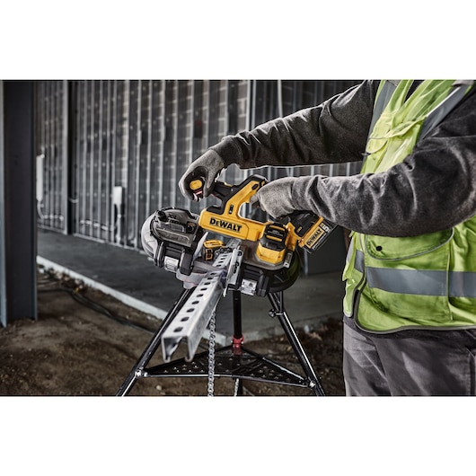 DEWALT Dual Trigger Bandsaw is used to cute strut from a pipe stand in a data center.