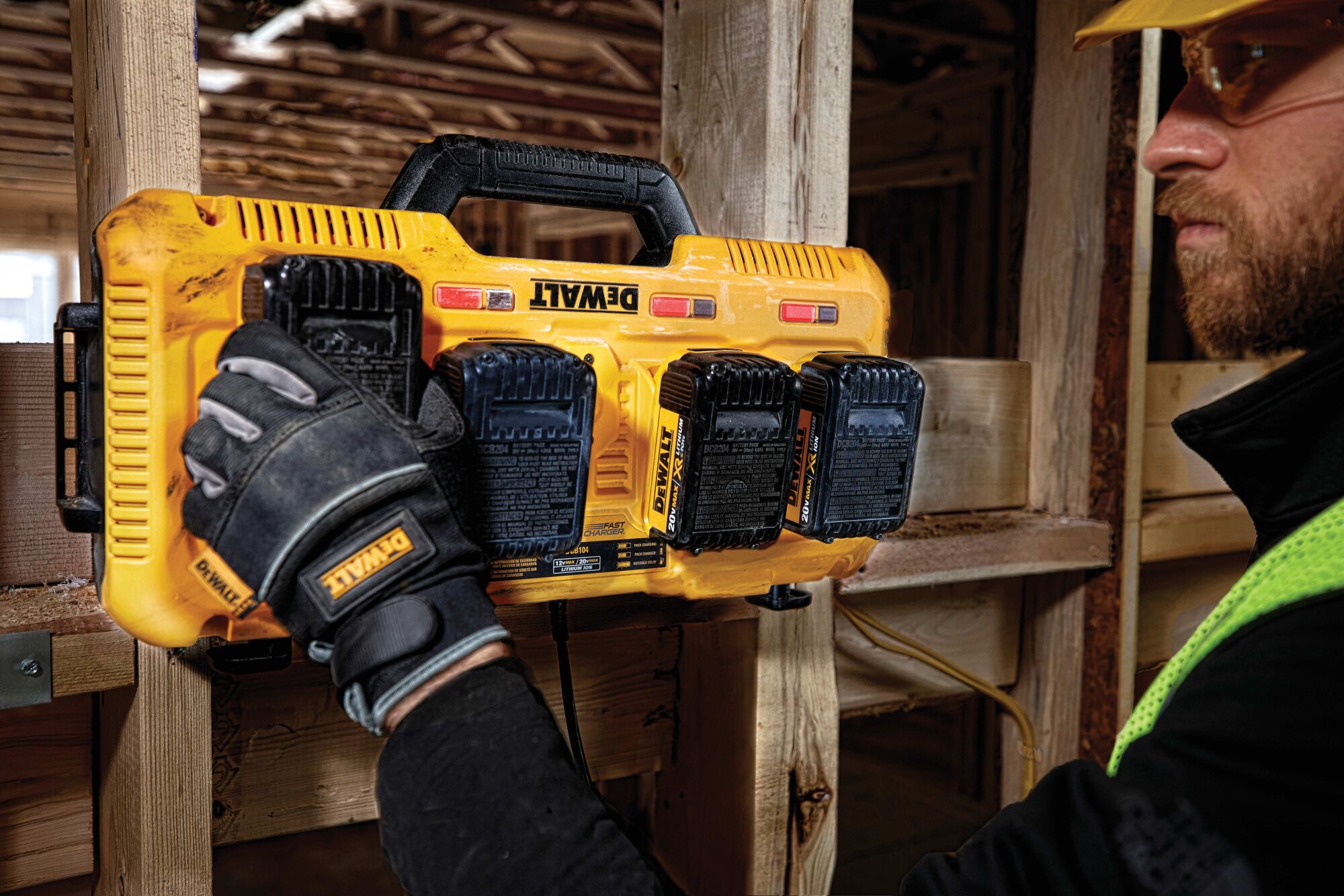 Battery being removed from  Multiport Fast Charger by a construction worker