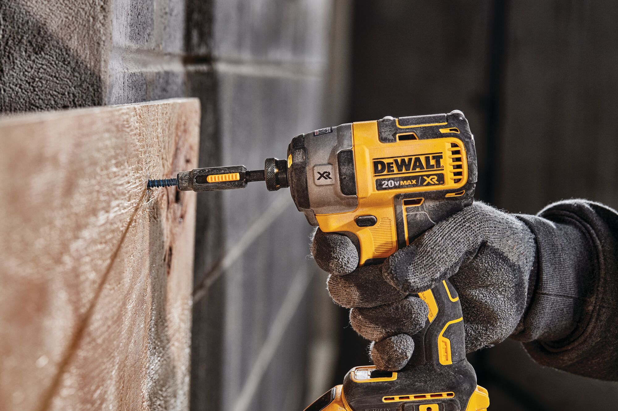 XR 3-speed impact driver fastening screw through wood on concrete. XR 3-speed impact driver fastening screw through wood on concrete.