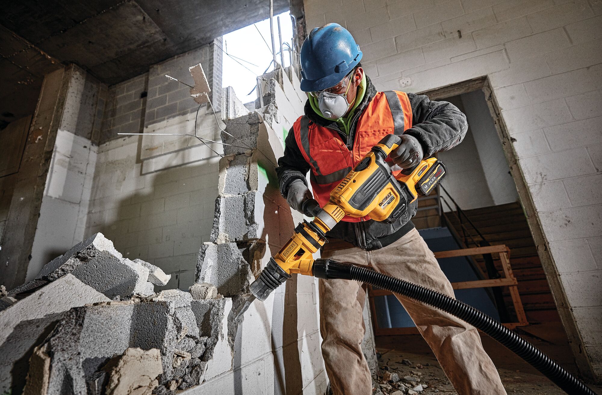 SDS MAX Brushless combination rotary hammer being used by a person SDS MAX Brushless combination rotary hammer being used by a person
