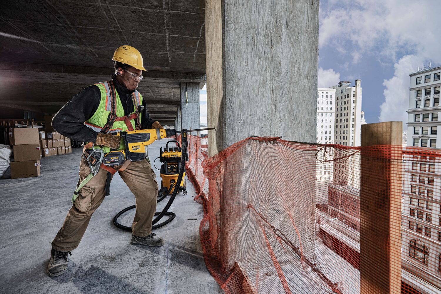 Brushless, cordless SDS MAX combination rotary hammer being used by a person Brushless, cordless SDS MAX combination rotary hammer being used by a person