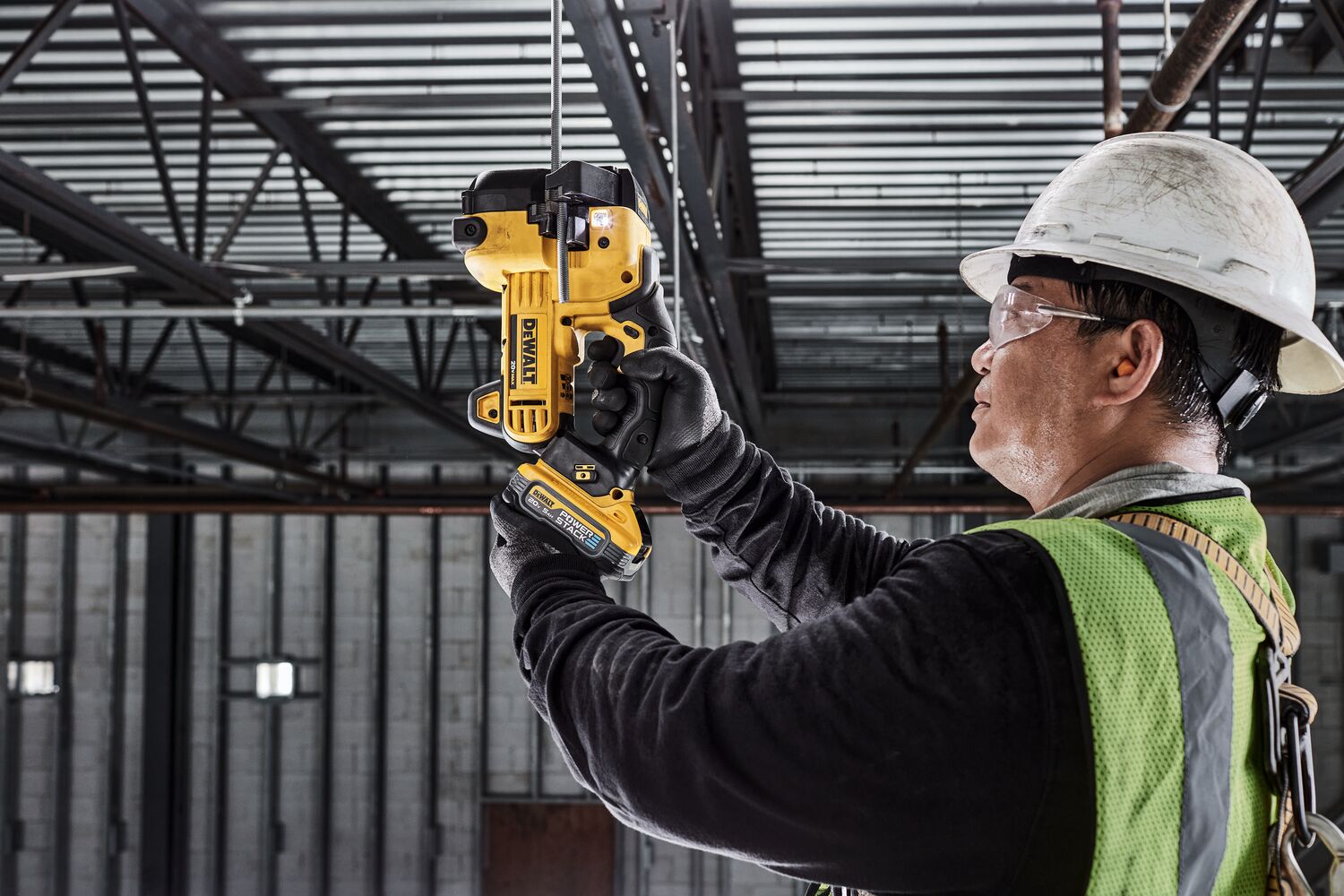 DEWALT Threaded Rod Cutter is being used to cut threaded rod overhead by tradesman in a data center. DEWALT Threaded Rod Cutter is being used to cut threaded rod overhead by tradesman in a data center.