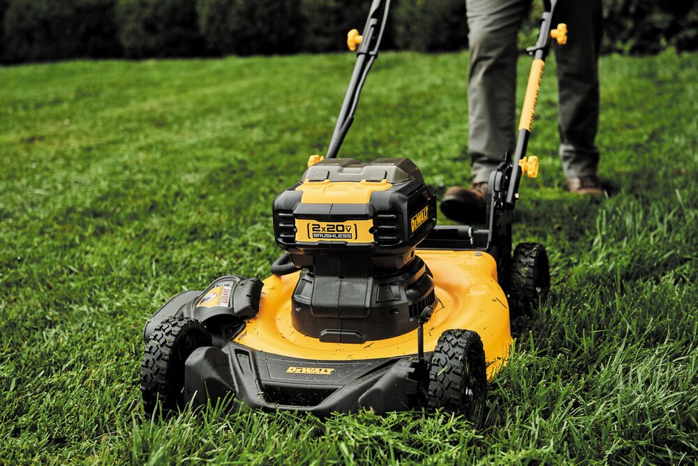 21 and a half inch Brushless Cordless Push mower being used to trim grass