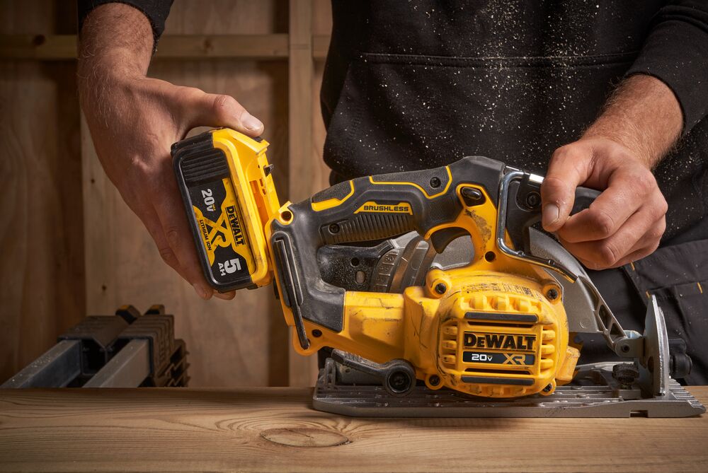 Battery compatibility feature of brushless cordless circular saw in action. Battery compatibility feature of brushless cordless circular saw in action.