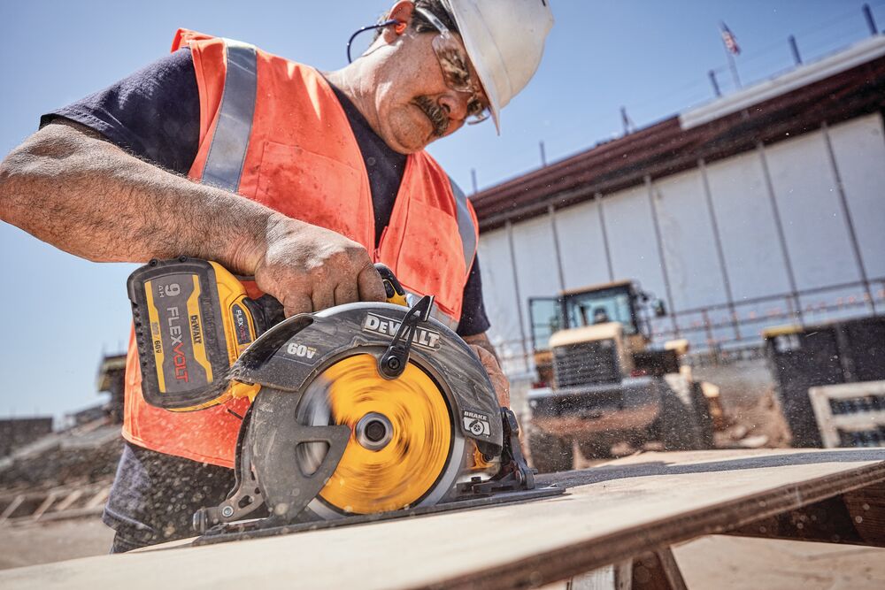 FLEXVOLT brushless cordless circular saw with brake kit being used by person on wood. FLEXVOLT brushless cordless circular saw with brake kit being used by person on wood.