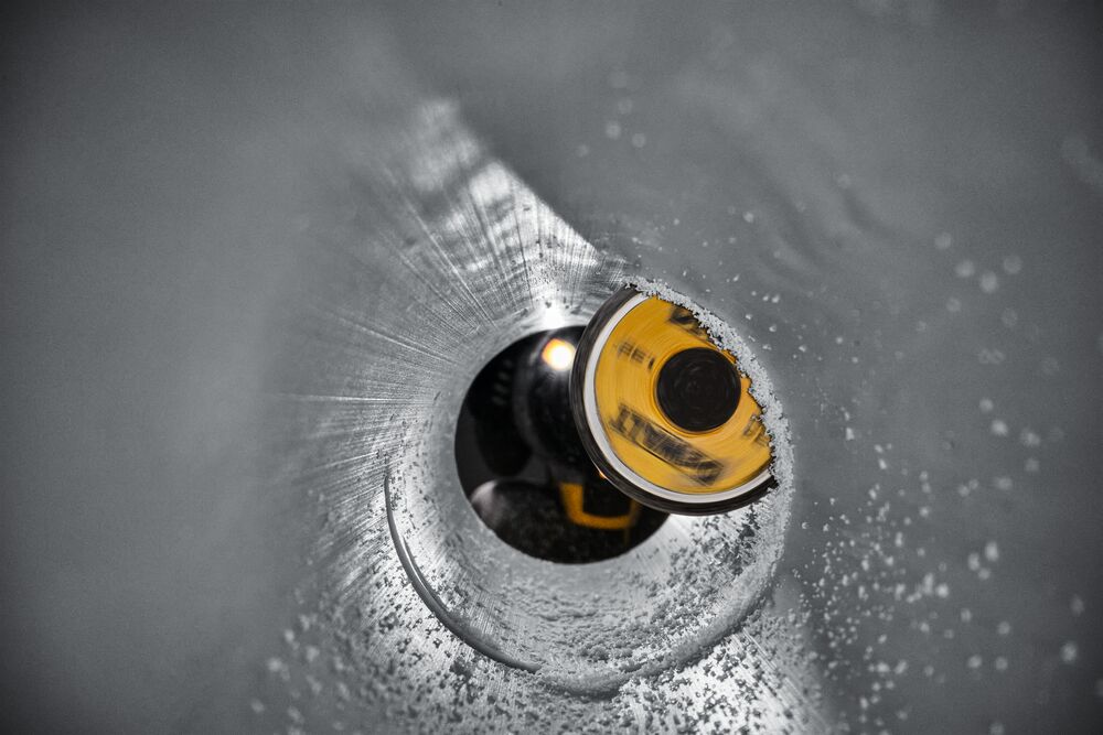 Inside Pipe Cutter cutting PVC pipe from inside view Inside Pipe Cutter cutting PVC pipe from inside view