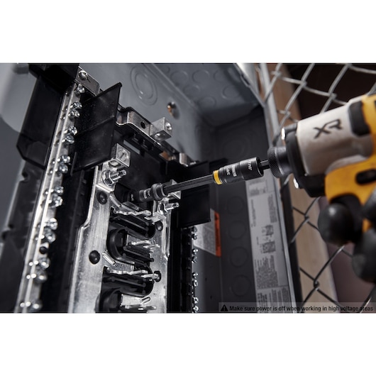 DEWALT Double ended nut driver taking out nut in an electrical box