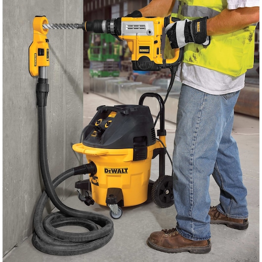 Large hammer dust extraction hole cleaning removing dust.