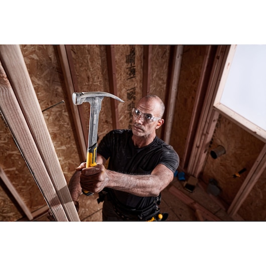 XP 1 Piece Steel MIG Weld Nailing Hammer being used by a person on nail in wood.