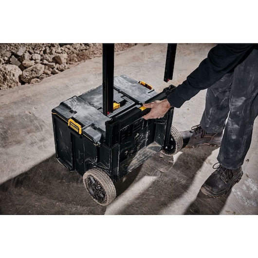 Handle of tough system 2.0 rolling toolbox being removed at a worksite.