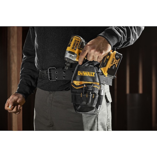 FRAMER WEARING DEWALT PROFESSIONAL NAIL POUCH
