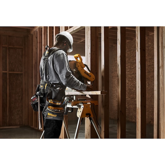 CONSTRUCTION WORKER WEARING DEWALT PROFESSIONAL DRILL HOLSTER