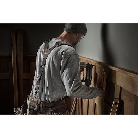 CONSTRUCTION WORKER WEARING DEWALT LEATHER TOOL BELT SUSPENDERS