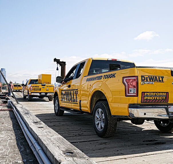 The back of a DEWALT branded F150 truck heading to a jobsite The back of a DEWALT branded F150 truck heading to a jobsite